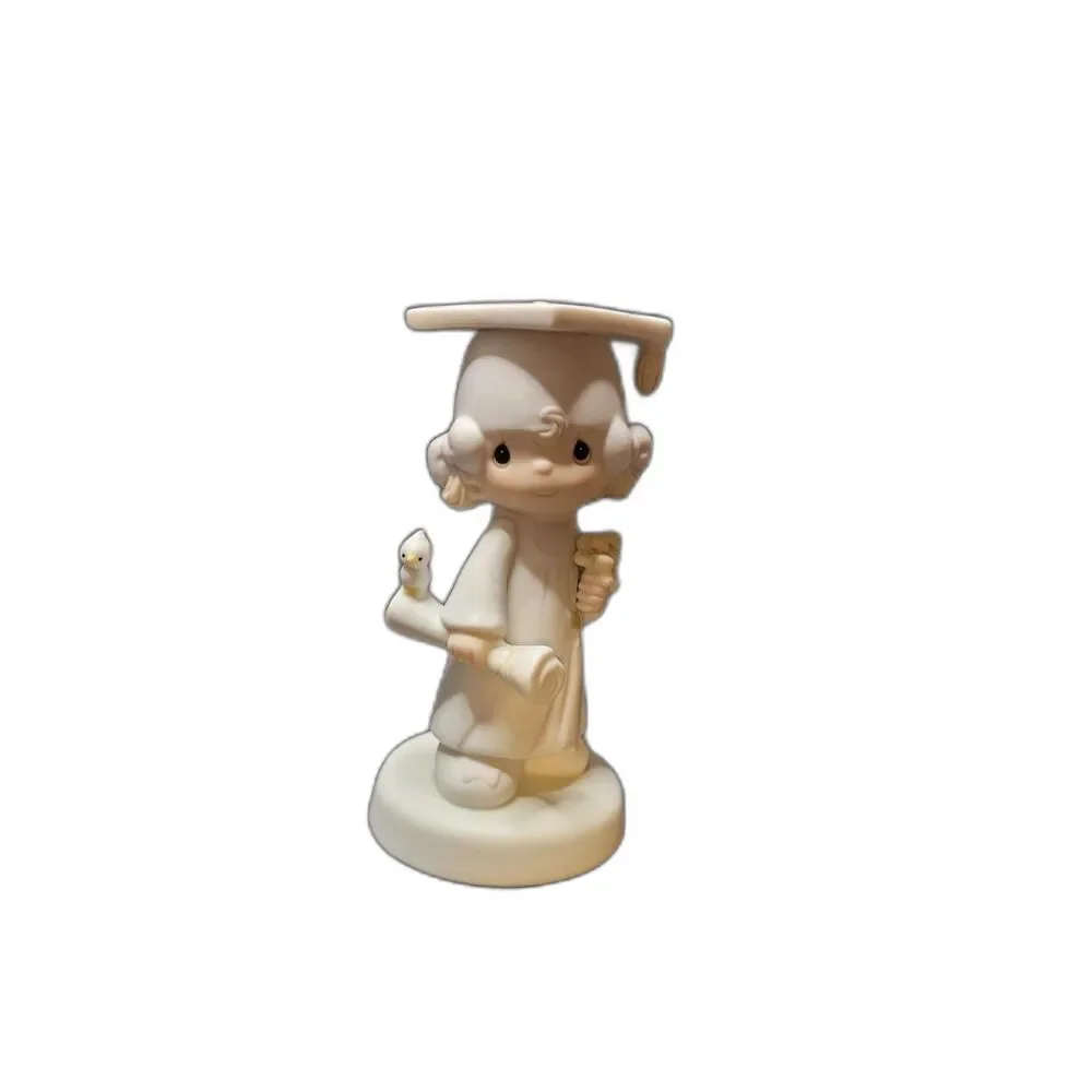 Precious Moments graduation figurine
